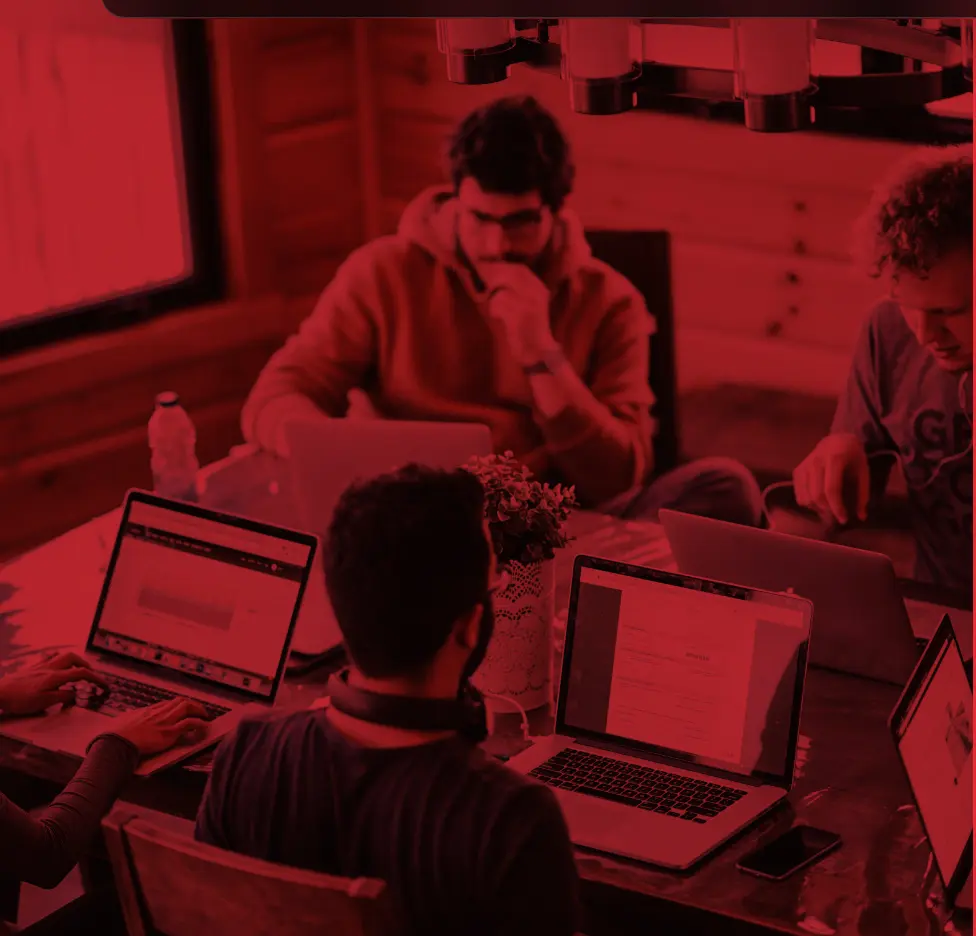 A technology team working together around a table