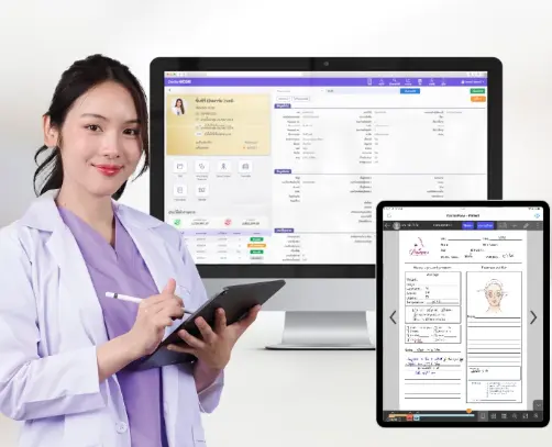 Clinician using a tablet alongside electronic medical record screens